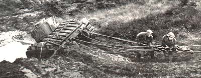 Scammel tractor recovering bogged Valentine tank